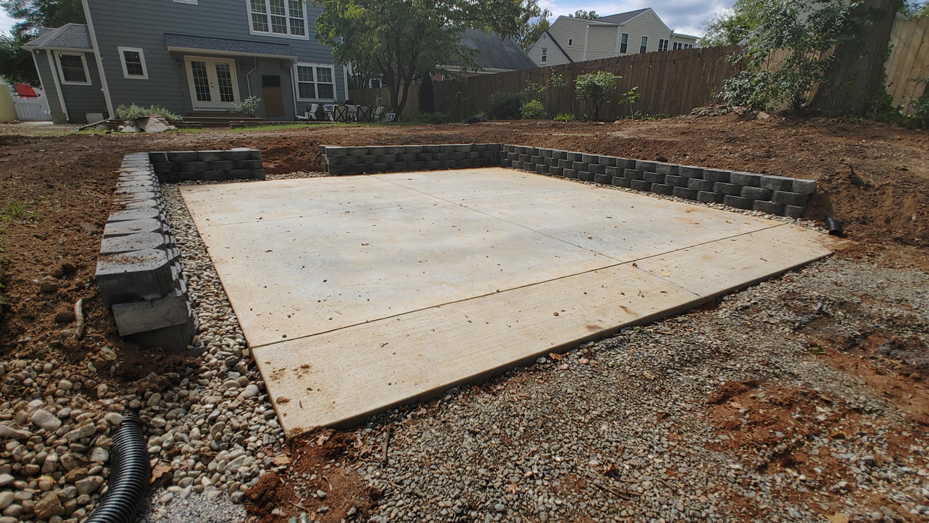 JT Contracting Concrete work - Monolithic concrete foundation with apron and retaining wall