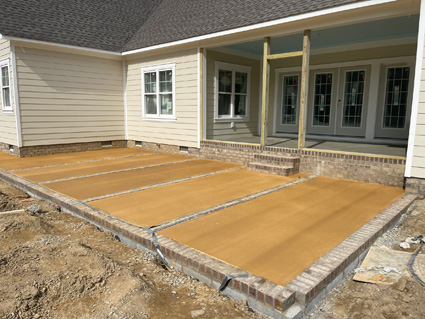 Brick and concrete patio on a new home build, in progress