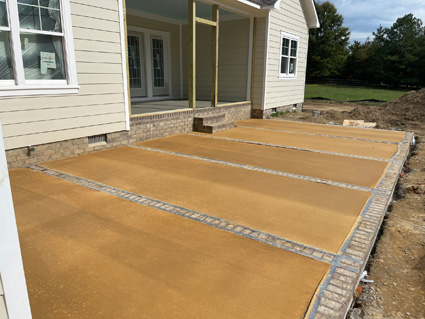 Brick and concrete patio on a new home build, in progress
