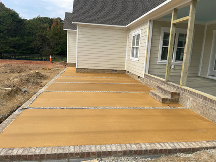 Brick and concrete patio on a new home build, in progress