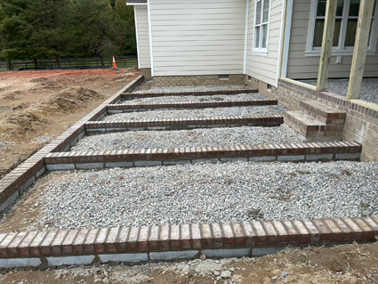 Brick and concrete patio on a new home build, in progress