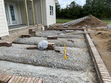 Brick and concrete patio on a new home build, in progress
